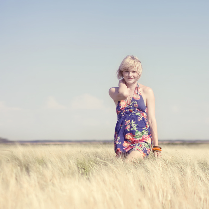 Beautiful blonde girl in a wheat field